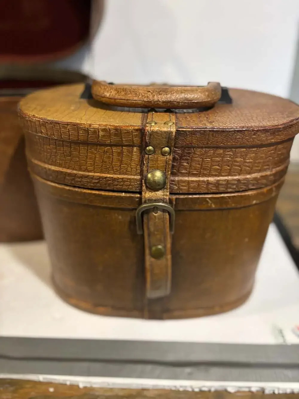 Vintage Oval Leather Hat Box with Brass Buckle and Burgundy Lining